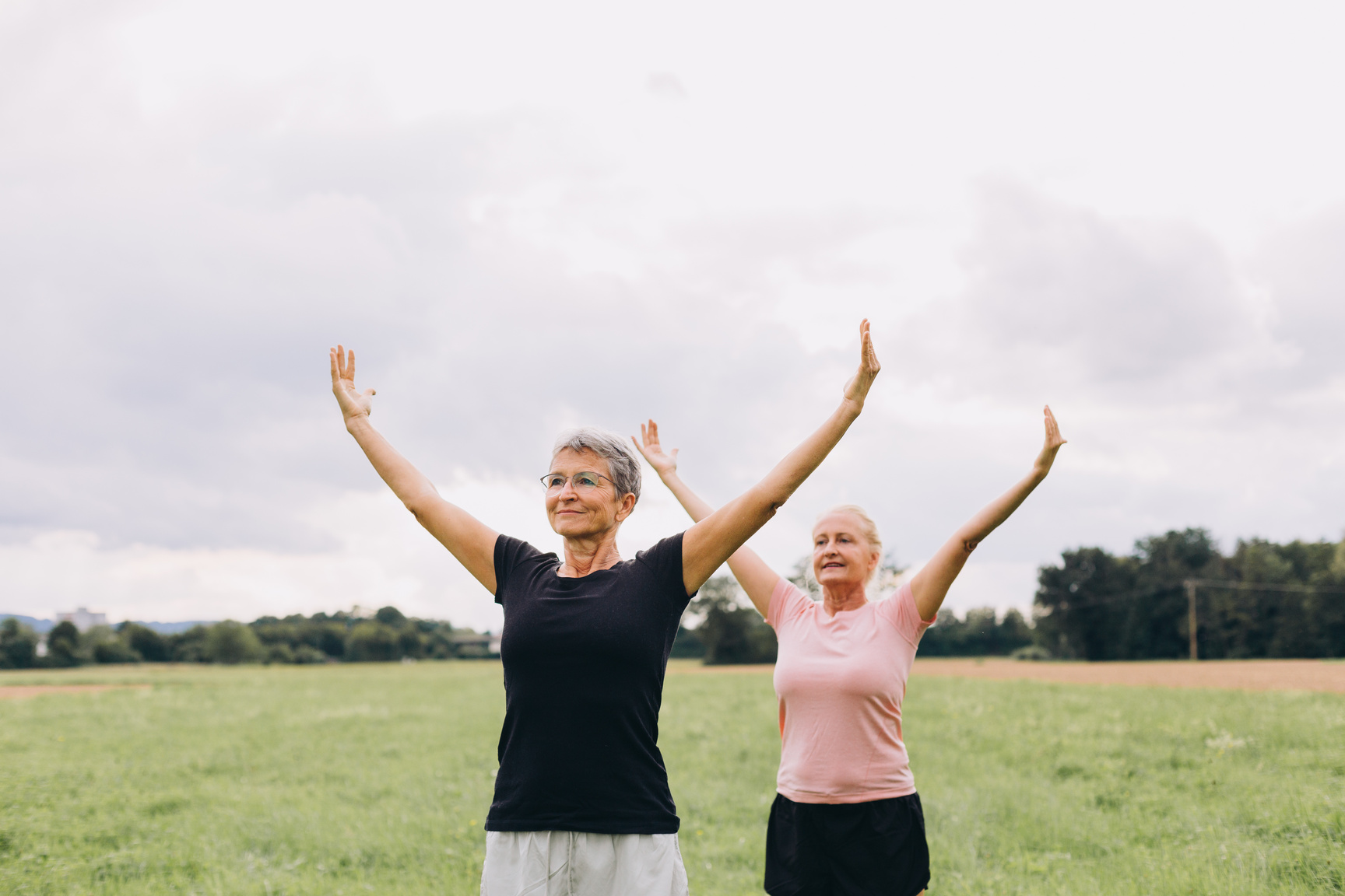 Elderly Women Doing Tai Chi Outdoors