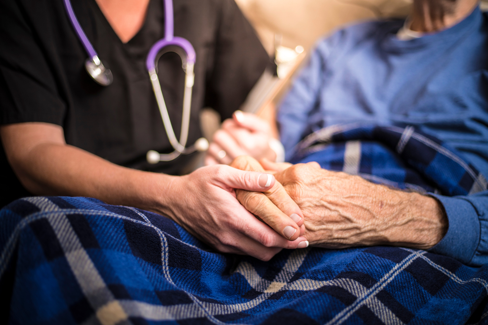 Hospice Nurse visiting an elderly male patient